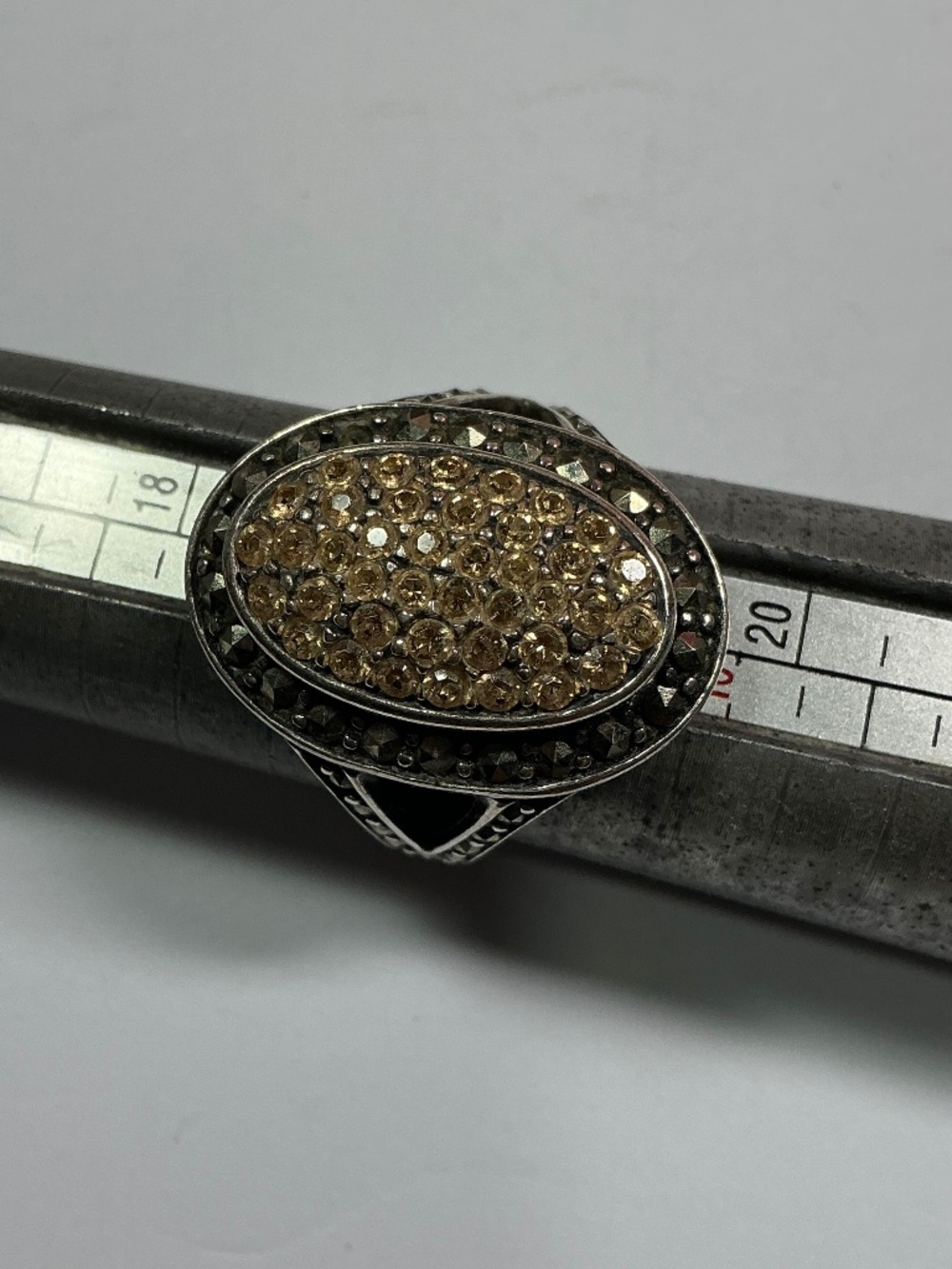 Sterling Silver Ring with Champagne Color Stones Surrounded by Marcasite. Size 9
